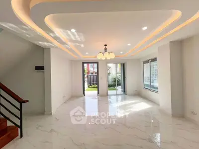 Spacious modern living room with elegant lighting and marble flooring