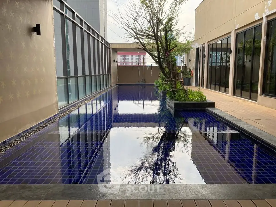Luxurious rooftop pool with modern design and city views, perfect for relaxation and leisure.