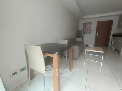 Modern living room with sleek furniture and open kitchen layout