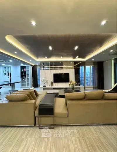 Luxurious modern living room with elegant lighting and spacious seating area.