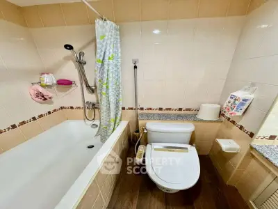 Charming bathroom with modern fixtures and cozy bathtub in a stylish apartment.