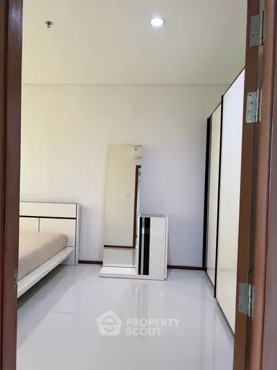 Modern bedroom with sleek furniture and minimalist design