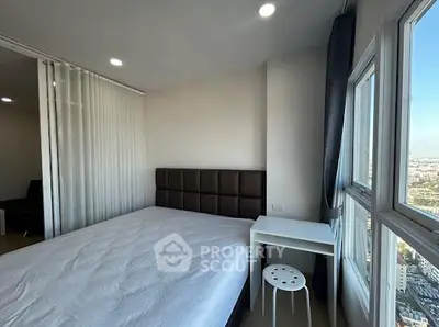 Modern bedroom with city view and minimalist decor