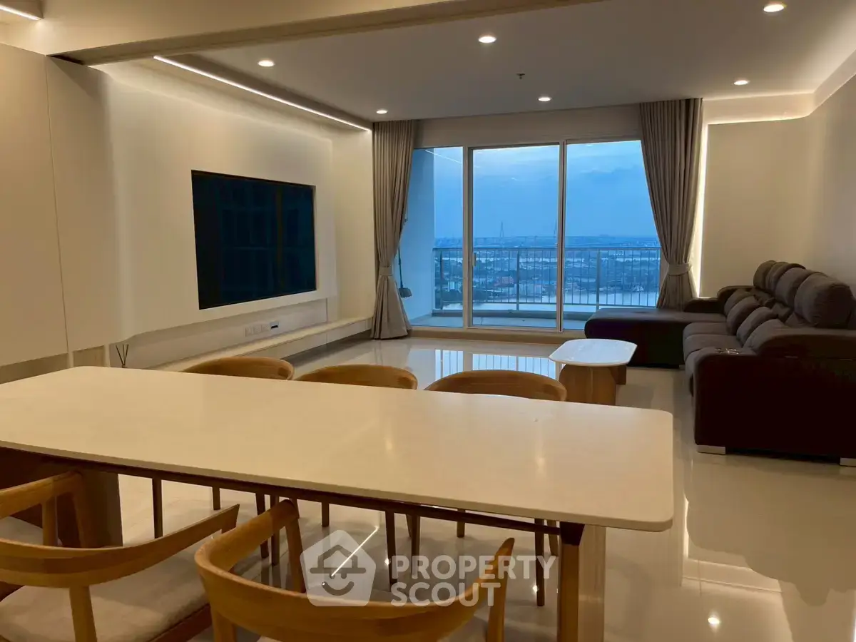 Spacious modern living room with large windows and stunning city view