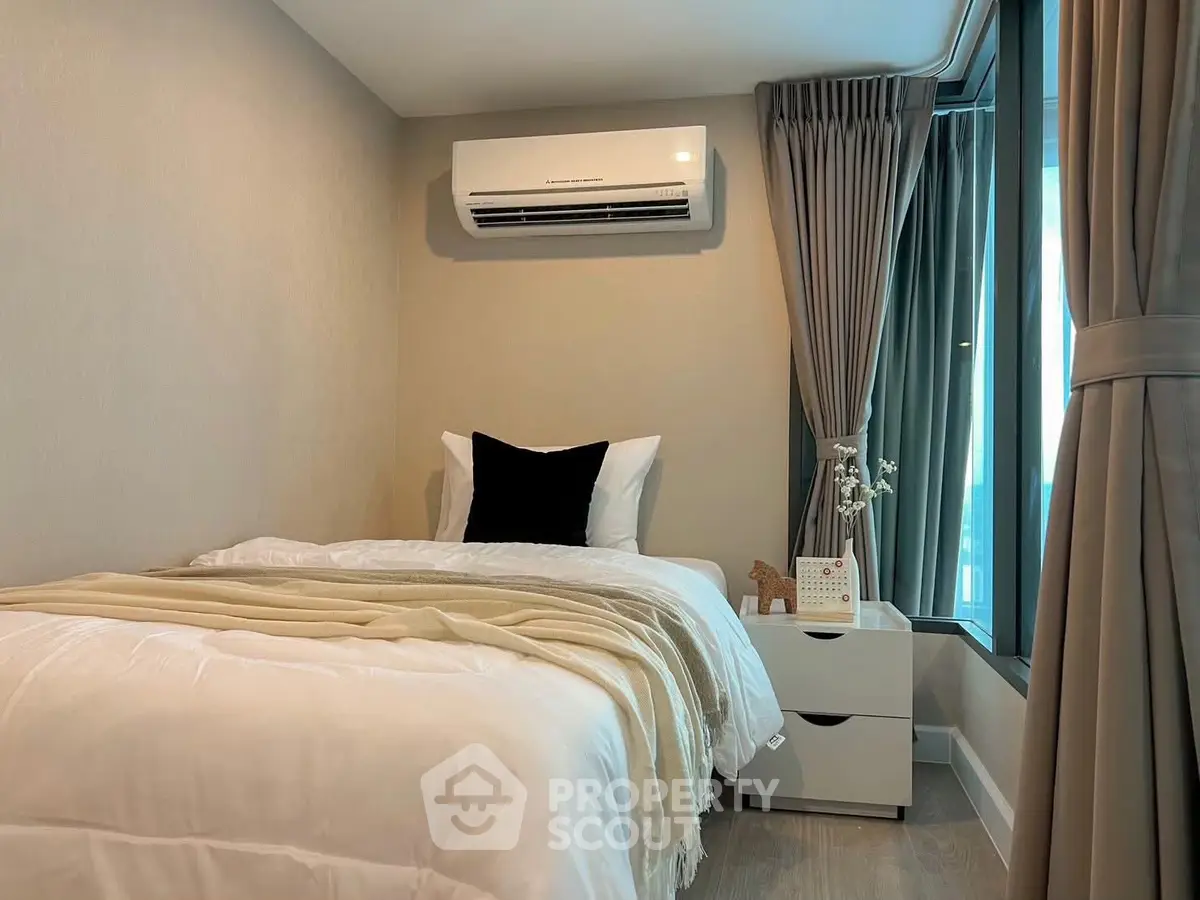 Cozy bedroom with modern air conditioning and elegant decor