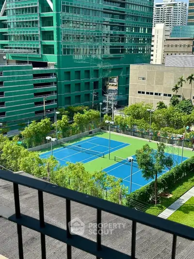 Stunning urban view with tennis courts and modern architecture, perfect for active lifestyle seekers.