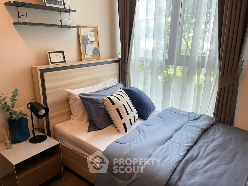 Cozy bedroom with modern decor and large window view