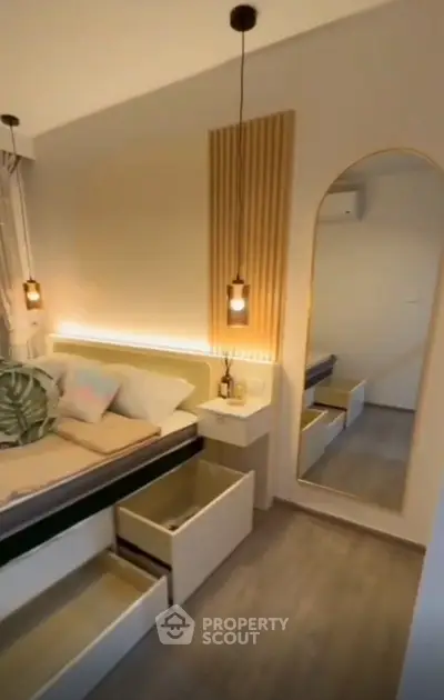 Modern bedroom with stylish lighting and built-in storage solutions