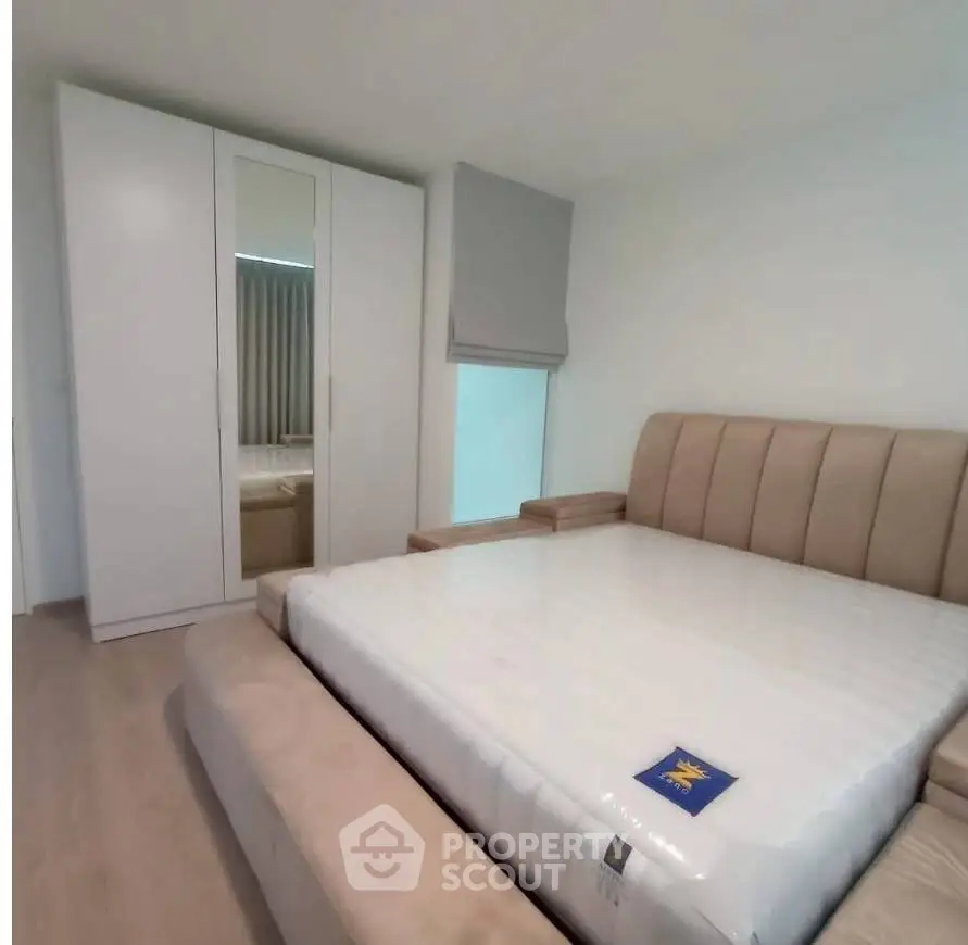 Modern bedroom with stylish bed and wardrobe in a cozy apartment