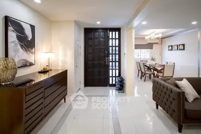 Spacious modern living room with elegant decor and dining area