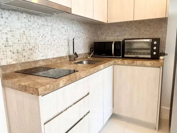 Modern kitchen with sleek countertops and built-in appliances for a stylish home.