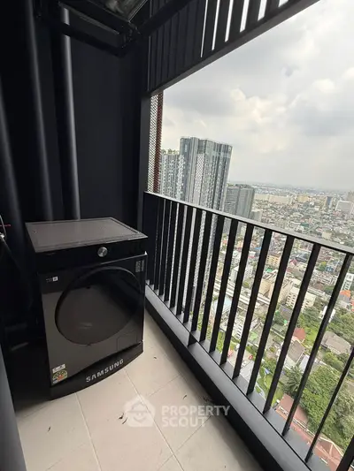 High-rise balcony with city view and modern washing machine.