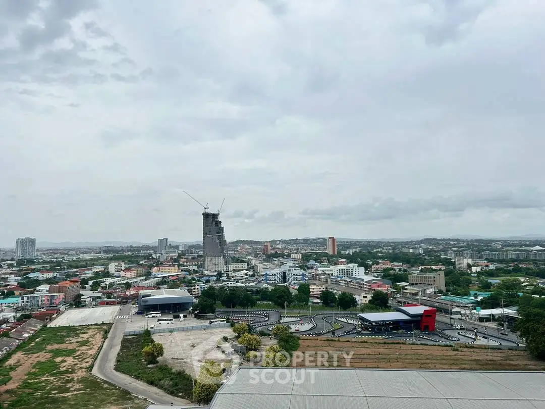Stunning cityscape view with a prominent skyscraper under construction, showcasing urban development.