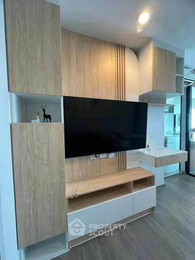 Modern living room with stylish wooden TV cabinet and sleek decor