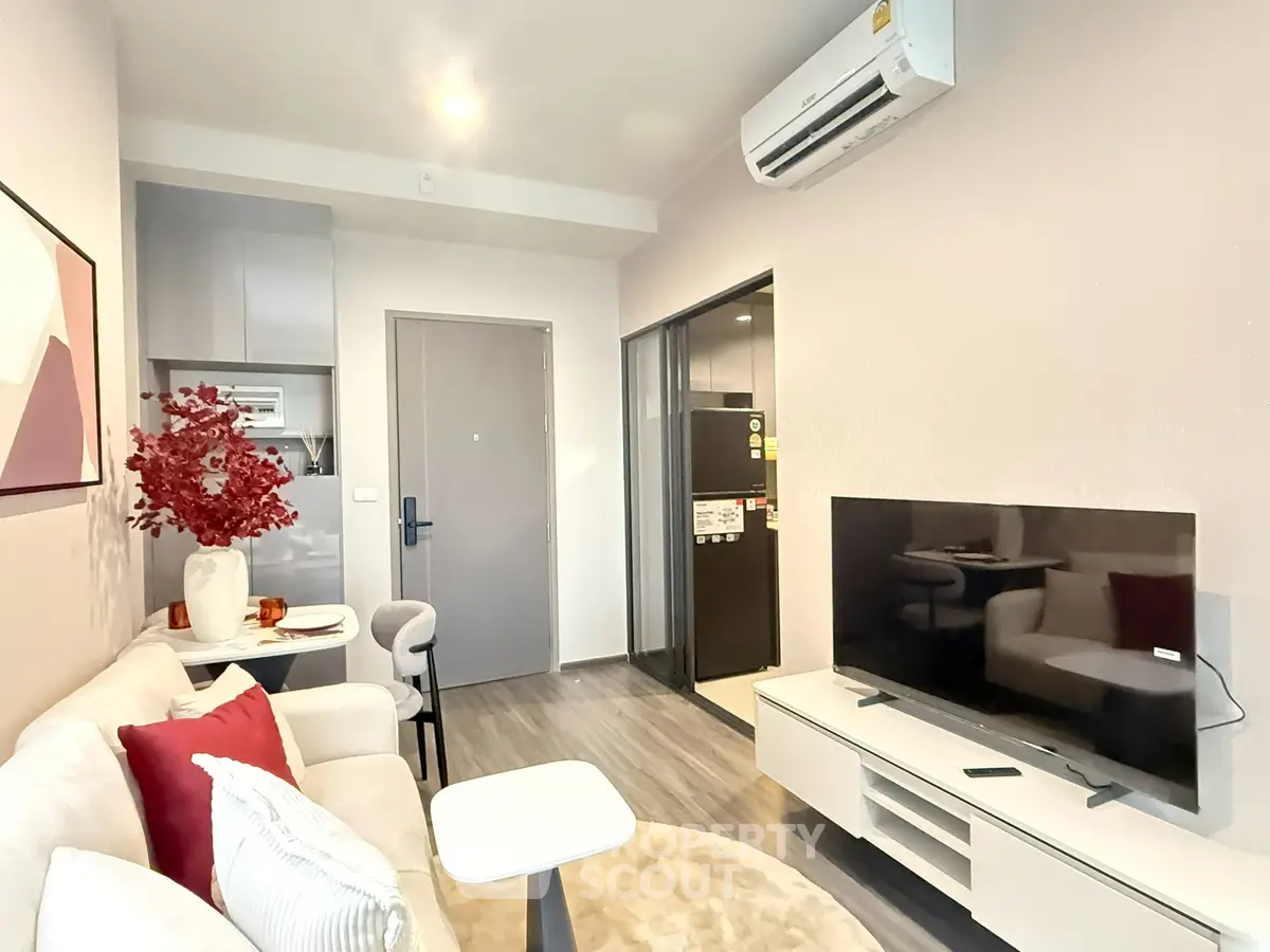 Modern living room with sleek furniture and air conditioning, perfect for comfortable urban living.
