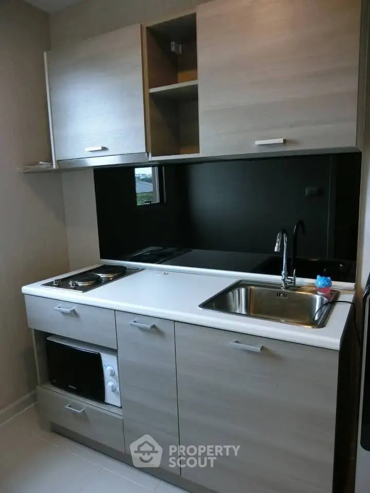 Modern kitchen with sleek cabinetry and built-in appliances, perfect for contemporary living.