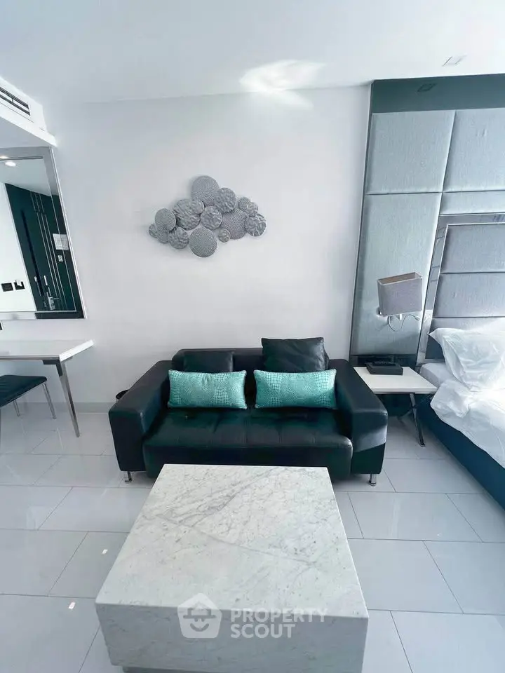 Modern living room with stylish decor and sleek furniture in a contemporary apartment.