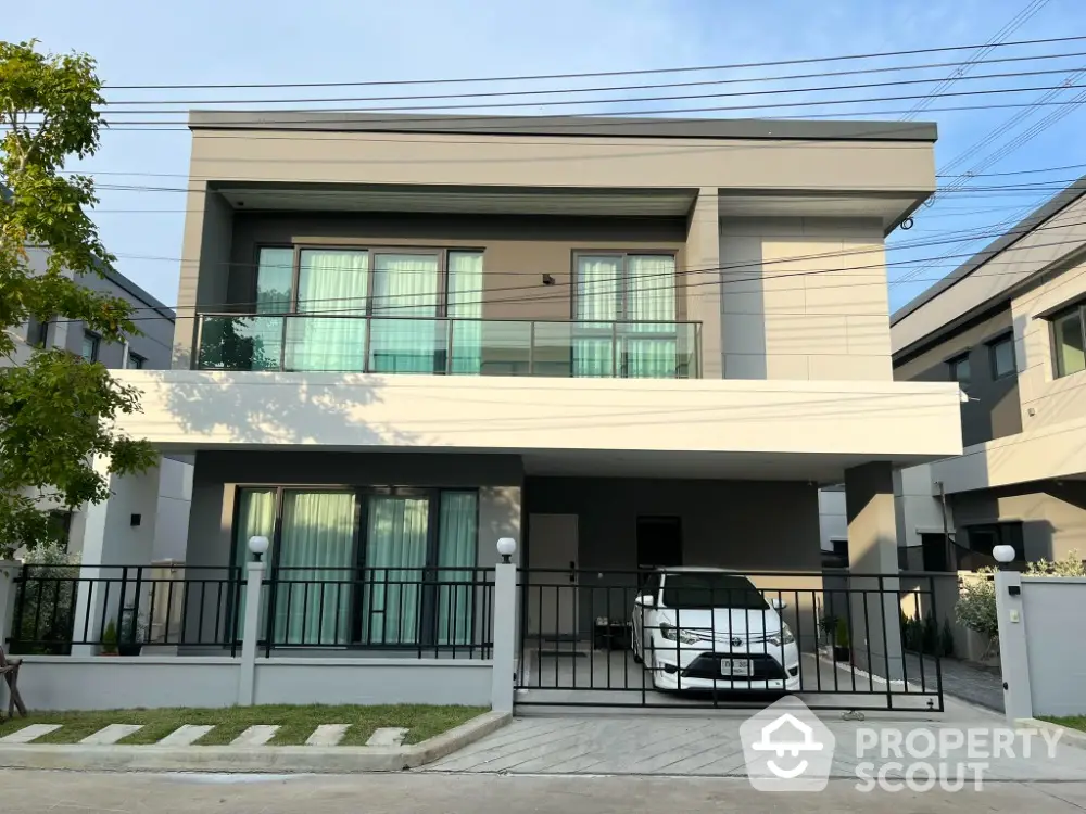 Modern two-story house with sleek design and spacious driveway