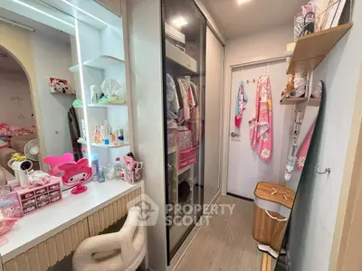 Charming bedroom with stylish vanity and ample closet space, perfect for a cozy and organized living.