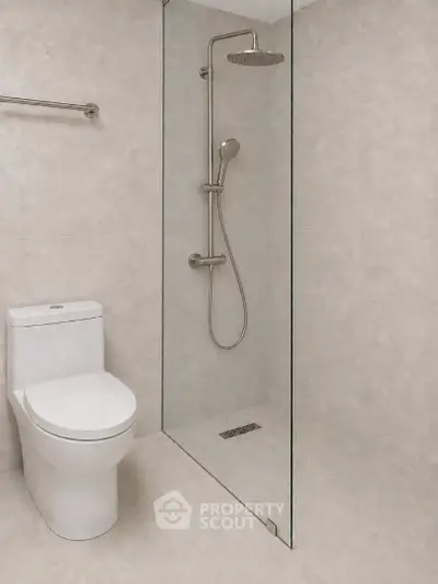 Modern bathroom with sleek shower and toilet in minimalist design.