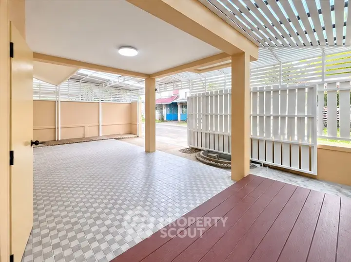 Spacious covered parking area with modern design and ample natural light.
