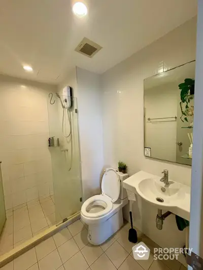 Modern bathroom with glass shower and sleek fixtures