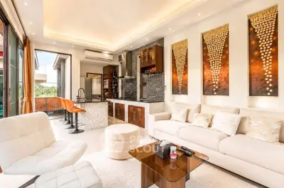 Luxurious modern living room with open kitchen and elegant decor