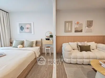 Modern bedroom and living area with stylish decor and cozy ambiance.