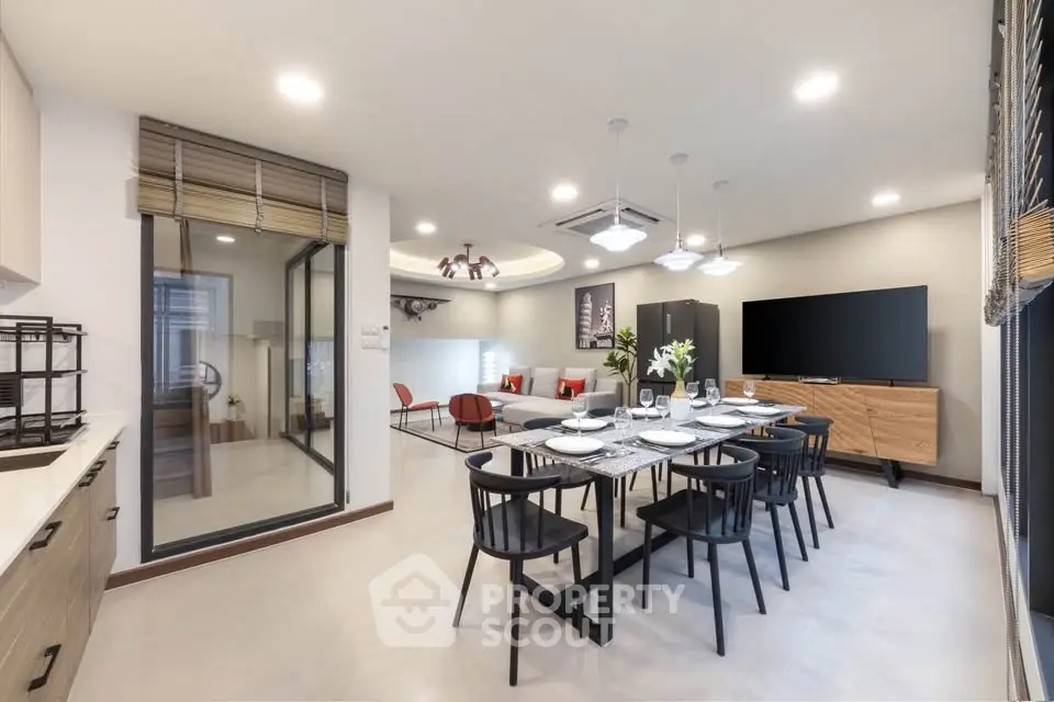 Spacious modern living and dining area with stylish decor and open layout
