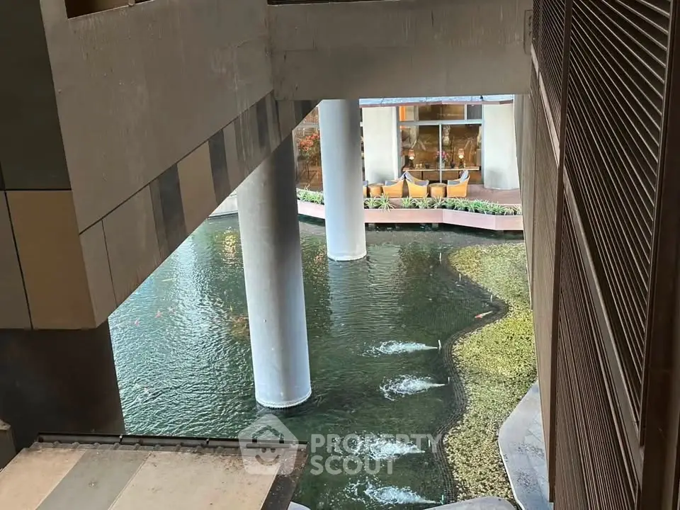 Modern architectural design with water feature in urban building complex