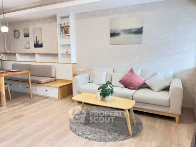 Modern living room with cozy sofa, wooden table, and stylish decor