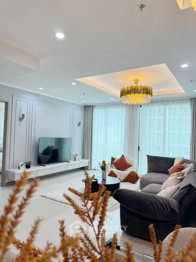 Luxurious living room with modern decor and elegant lighting