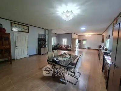 Spacious open-plan living and dining area with elegant decor and ample natural light.