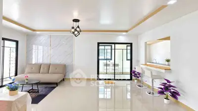 Spacious modern living room with open kitchen and elegant decor