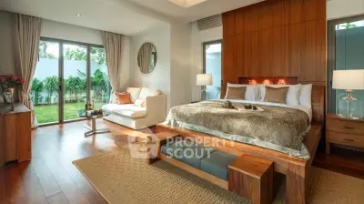 Luxurious bedroom with garden view and elegant wooden furnishings