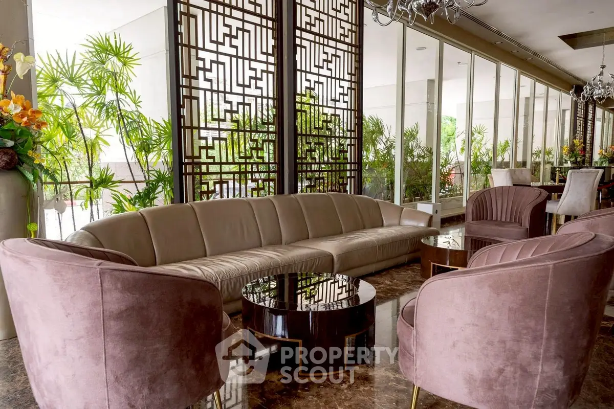 Luxurious living room with elegant decor and plush seating in modern apartment.