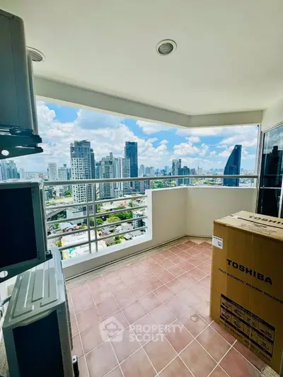 Spacious balcony with stunning city skyline view, perfect for relaxation and enjoying urban living.