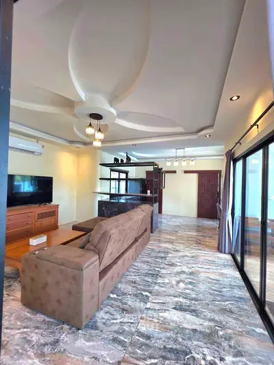 Spacious living room with modern design and marble flooring in luxury apartment