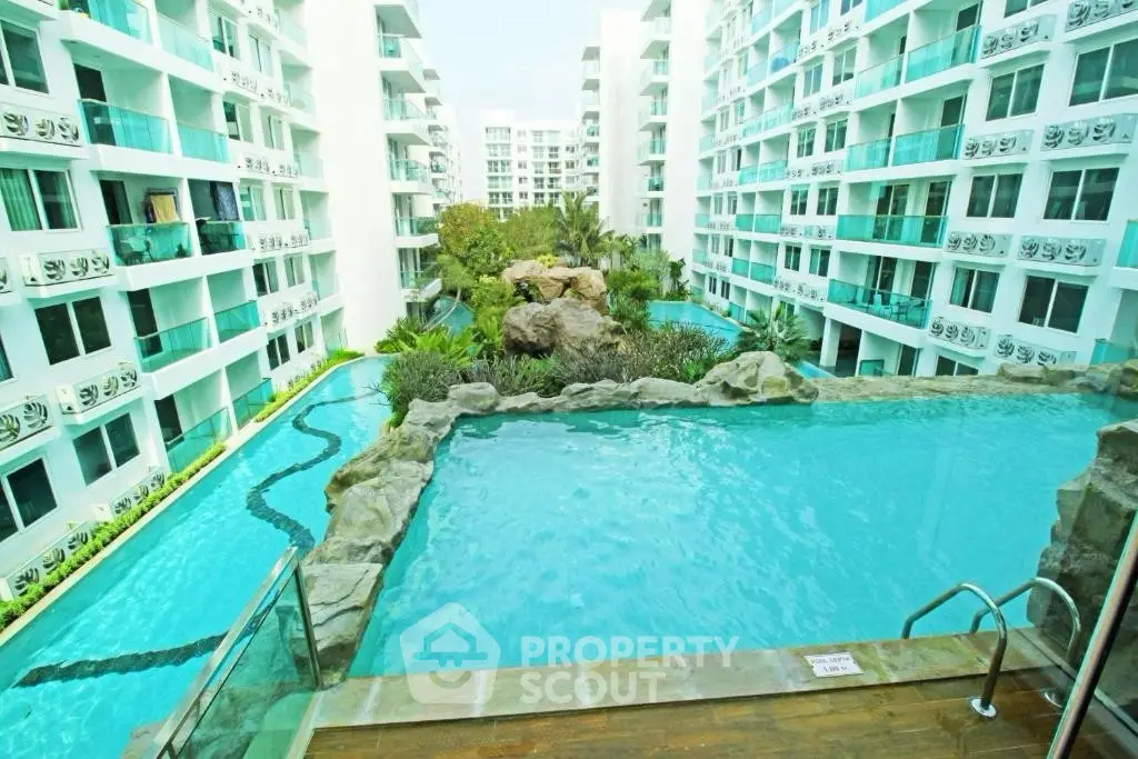 Luxurious apartment complex with stunning pool and modern architecture