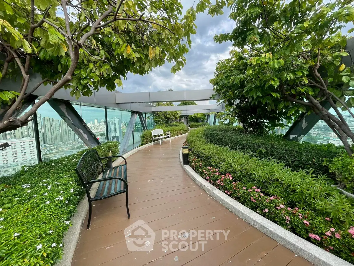 Stunning rooftop garden with panoramic city views and lush greenery.