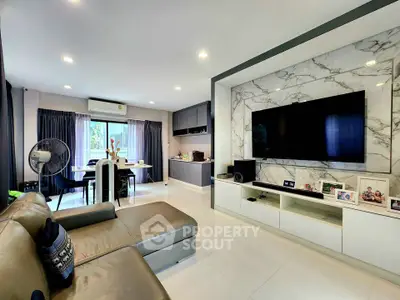 Modern living room with sleek marble TV wall and open dining area, perfect for stylish urban living.