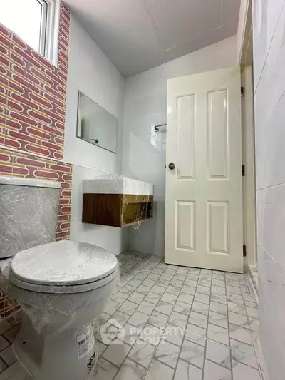 Modern bathroom with stylish tile design and sleek fixtures