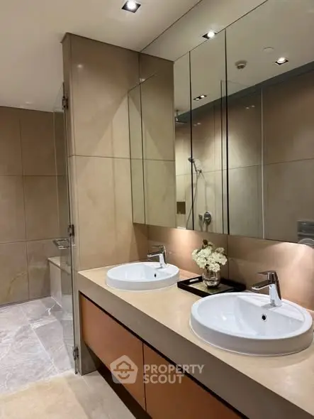 Luxurious modern bathroom with dual sinks and elegant lighting