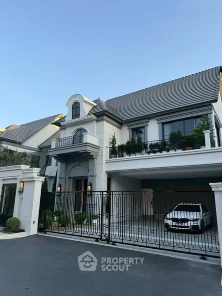 Luxurious modern house with gated entrance and spacious driveway