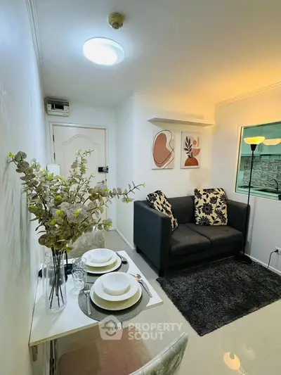 Cozy living room with modern decor and dining setup, perfect for urban living.