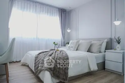 Elegant bedroom with cozy decor and natural light