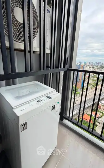High-rise apartment balcony with washing machine and city view