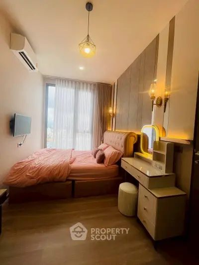 Cozy bedroom with modern decor and large window offering natural light