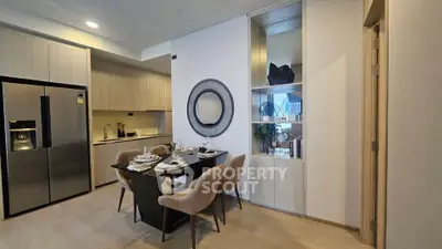 Modern dining area with elegant decor and open kitchen layout