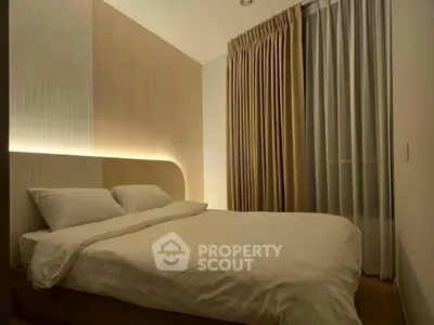 Cozy modern bedroom with ambient lighting and elegant curtains